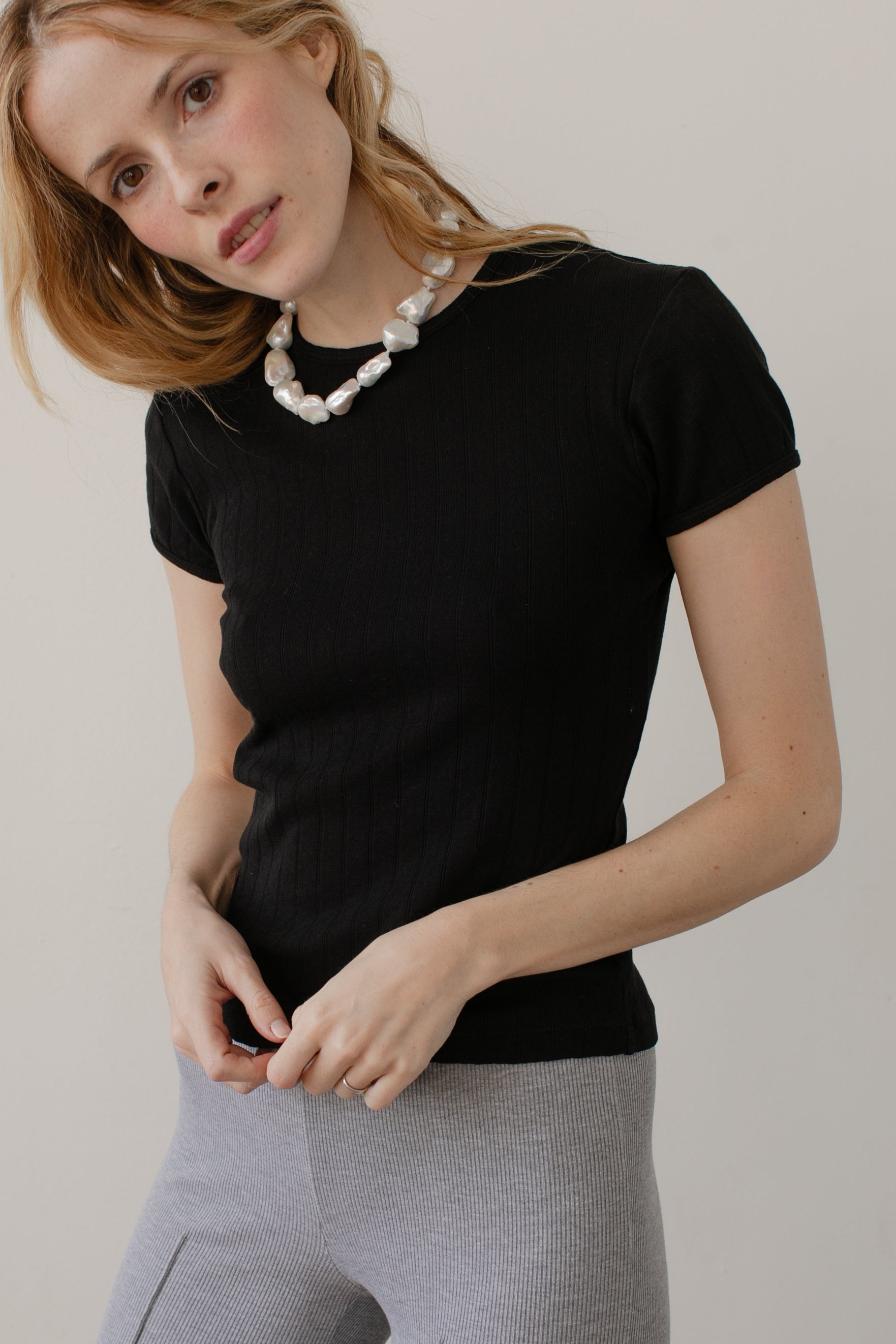 DONNI. The Pointelle Baby Tee at Romi Boutique