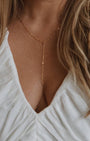 Romi KAMRYN LARIAT NECKLACE IN GOLD at Romi Boutique