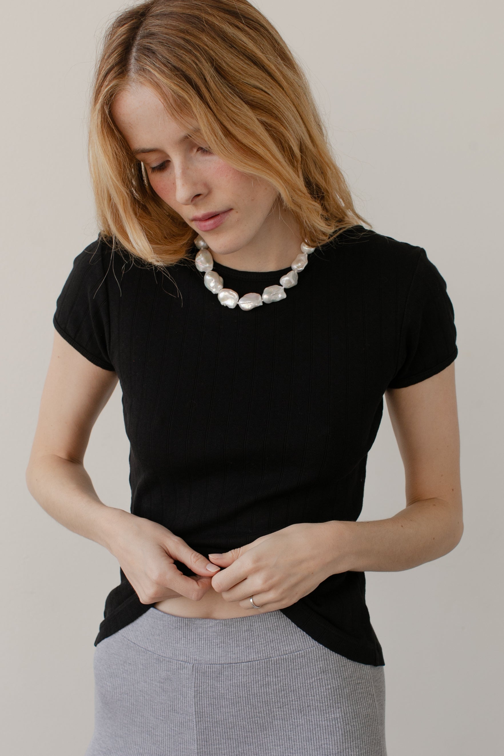 DONNI. The Pointelle Baby Tee at Romi Boutique