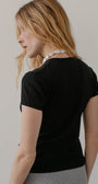 DONNI. The Pointelle Baby Tee at Romi Boutique