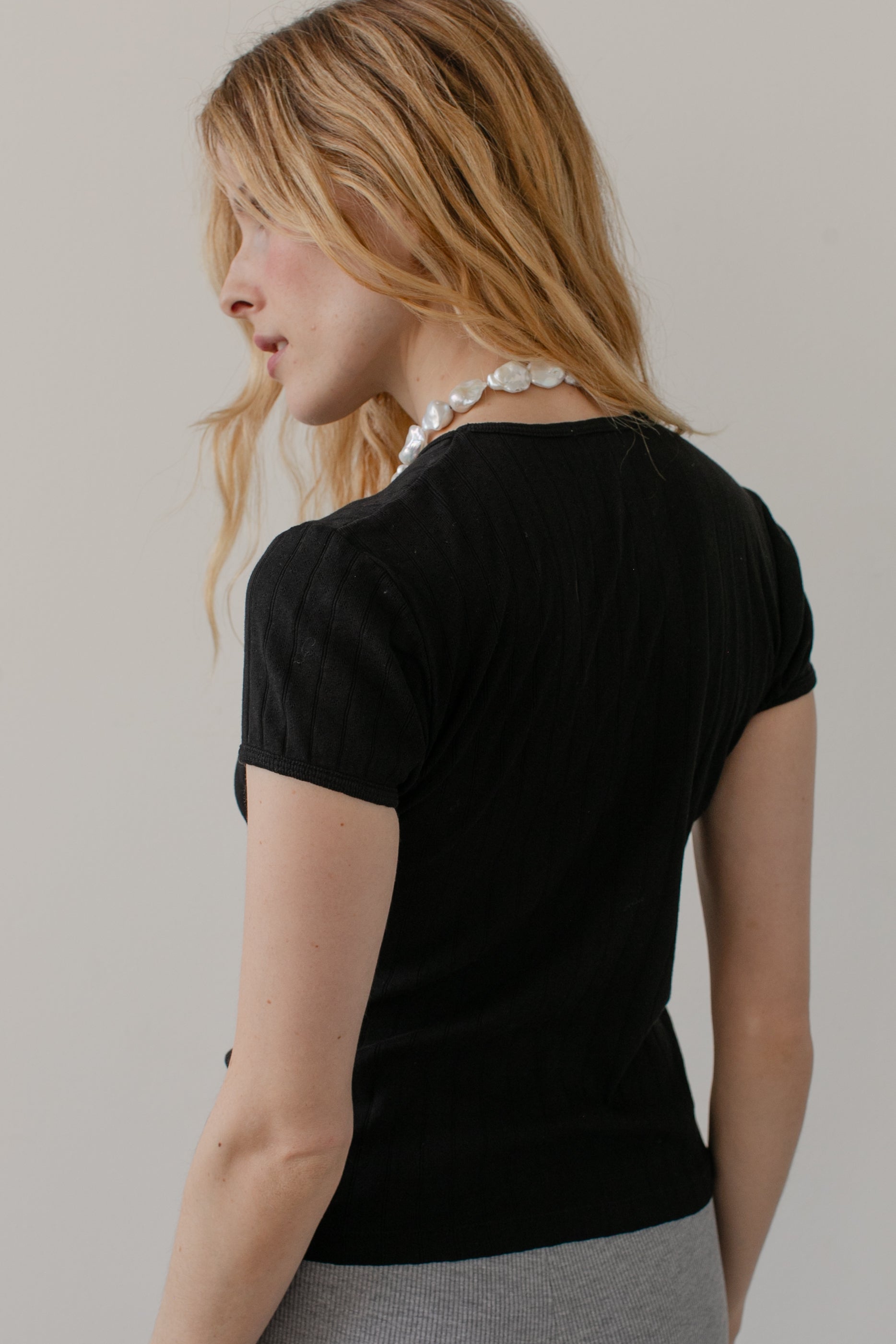 DONNI. The Pointelle Baby Tee at Romi Boutique