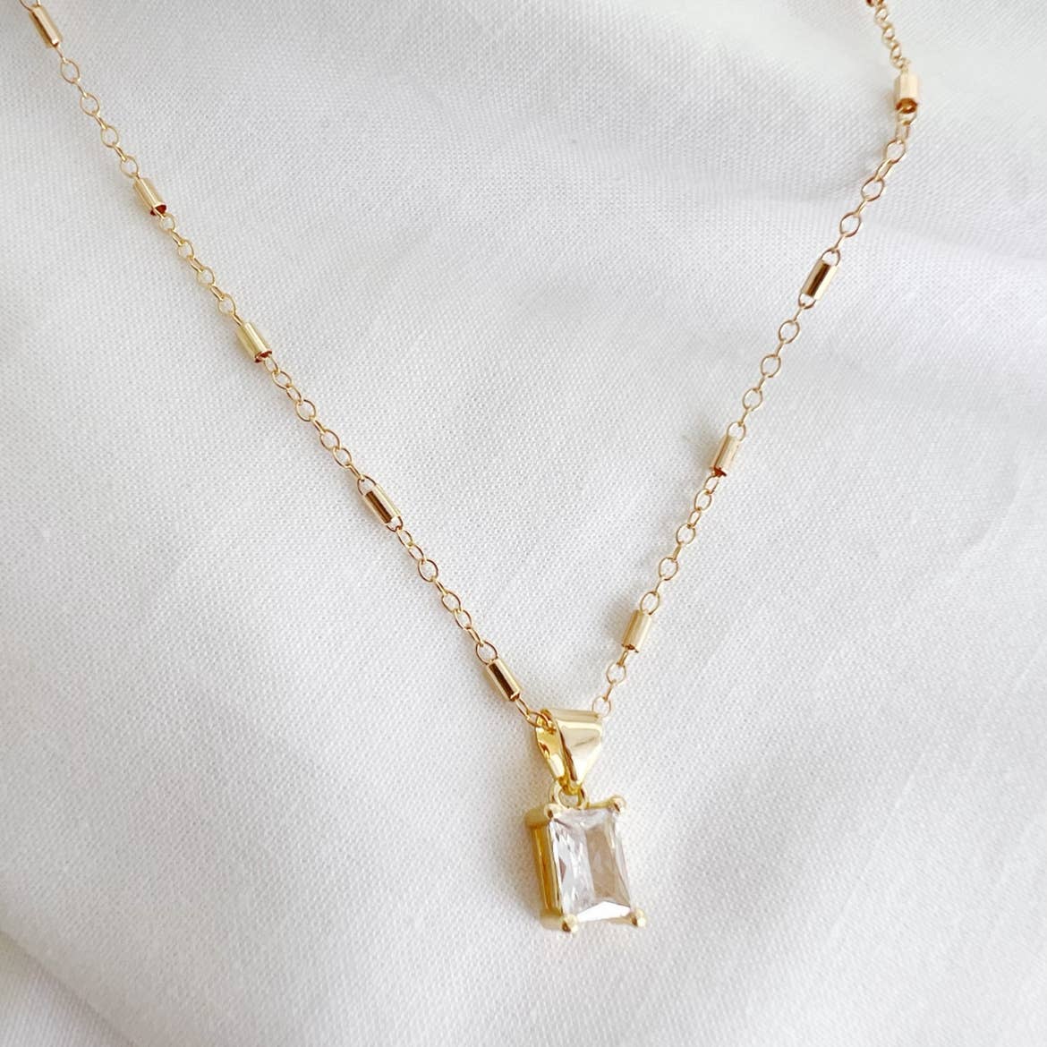 GOLDIE CLEAR CZ PENDANT NECKLACE IN GOLD