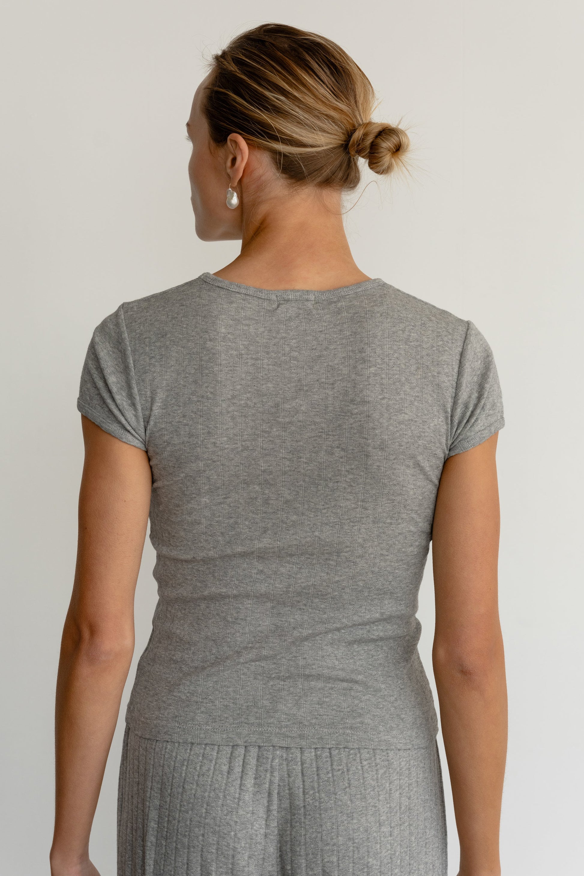 DONNI. THE POINTELLE BABY TEE at Romi Boutique