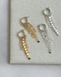 Maya Bauman FEATHER EARRINGS IN GOLD at Romi Boutique