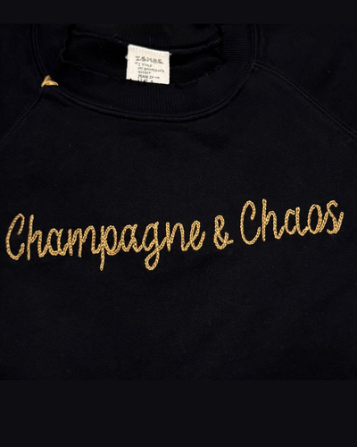 CHAMPAGNE & CHAOS CREW SWEATSHIRT IN BLACK/GOLD